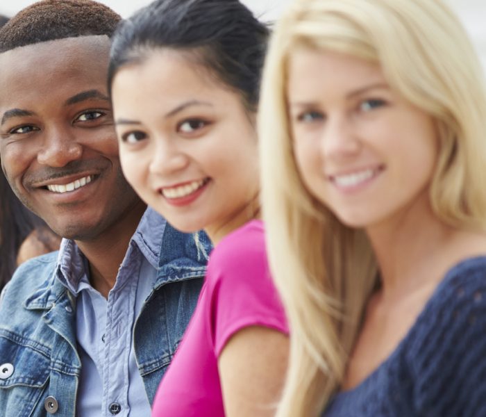 Portrait Of University Students Outdoors On Campus