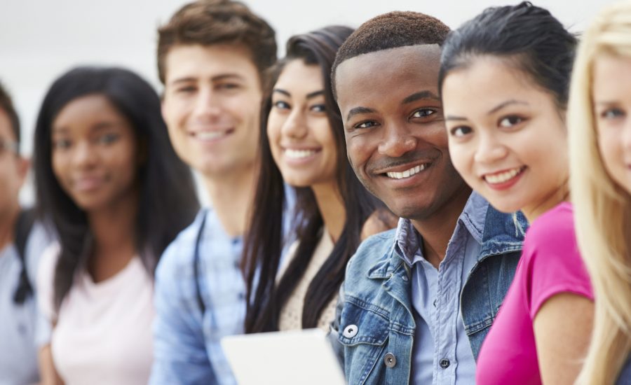 Portrait Of University Students Outdoors On Campus